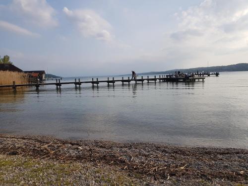 a group of people on a dock in the water at Casa Piedro in Starnberg