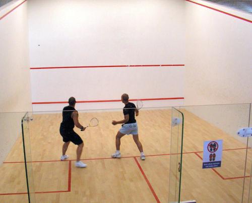 two men playing a game of volley ball in a gym at Las Tortugas, Cozy condominium on Khao Tao beach, Hua Hin in Khao Tao