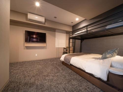 Letto o letti in una camera di Super Hotel Premier Sendai Kokubuncho Tennenonsen