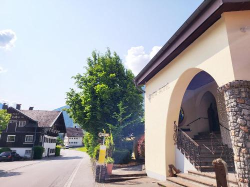 a building with an arch on the side of a street at Wanderhotel Garni Cresta in Schruns