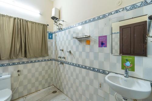 a bathroom with a sink and a toilet at Zostel Visakhapatnam (Vizag) in Visakhapatnam