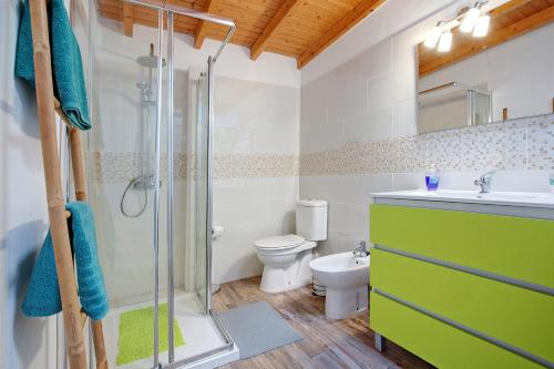 a bathroom with a shower and a sink and a toilet at Laikas house in Costa Calma