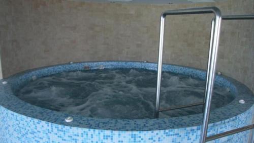 a jacuzzi tub in a bathroom with at ‘Good Feelings’ in Siófok