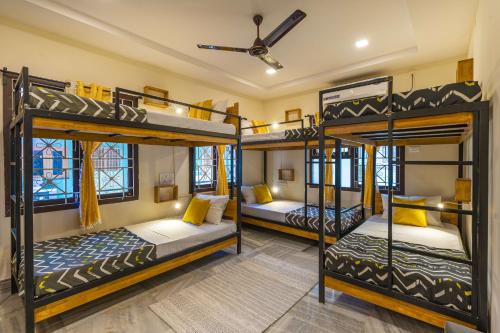 a room with four bunk beds in it at Zostel Visakhapatnam (Vizag) in Visakhapatnam