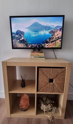 a tv sitting on top of a tv stand at Touristarea Sea&City Lifestyle studio in Limassol
