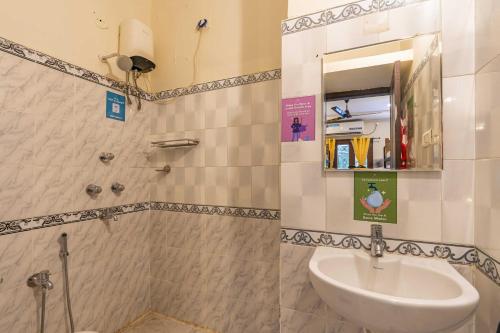 a bathroom with a sink and a mirror at Zostel Visakhapatnam (Vizag) in Visakhapatnam