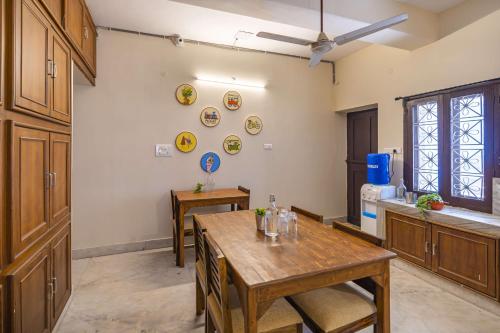 a room with a table and plates on the wall at Zostel Visakhapatnam (Vizag) in Visakhapatnam