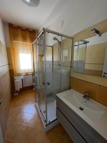 a bathroom with a shower and a sink at Nautilus Appartamenti a mare in Ortona