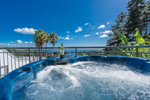 a hot tub with water in a pool at Palm Beach Cottage with Private Spa Pool in Palm Beach