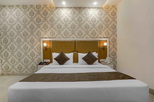 Ένα ή περισσότερα κρεβάτια σε δωμάτιο στο Hotel Paris Chandigarh Zirakpur