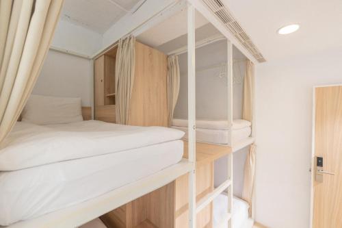 Postel nebo postele na pokoji v ubytování OwlStay Flip Flop Hostel - Garden