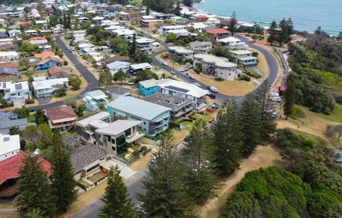 an aerial view of a town next to the ocean at La Ronde Three - Unit 3 - Oceanstays in Yamba