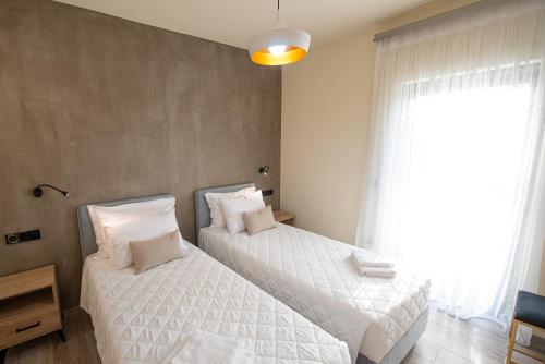 Letto o letti in una camera di Aerinos private villa