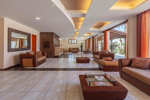 a large living room with couches and a table at Villa Zina Family Resort in Custonaci