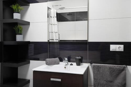 a bathroom with a sink and a mirror at Casa Maria in Playa Blanca