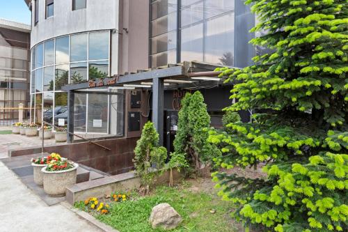 a building with a sign on the front of it at Hotel Charter Otopeni in Otopeni