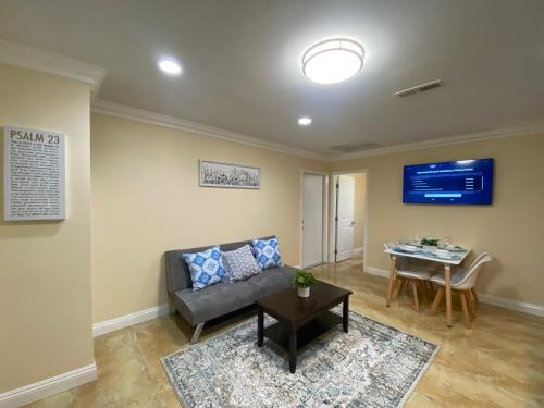 a living room with a couch and a table at Huntington Beach adorable 2 bedrooms, 2 bathrooms in Huntington Beach