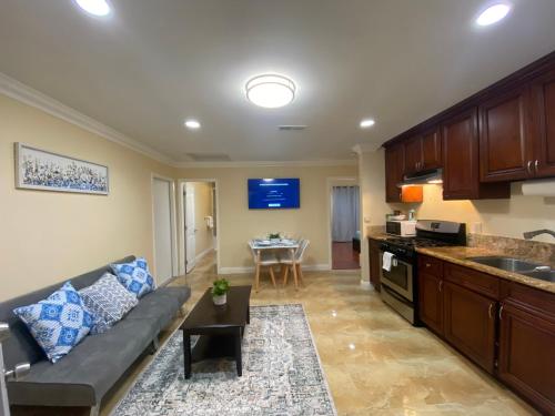 a living room with a couch and a kitchen at Huntington Beach adorable 2 bedrooms, 2 bathrooms in Huntington Beach