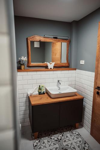 a bathroom with a sink and a mirror at Kocbek since 1929 in Sveti Jurij ob Ščavnici