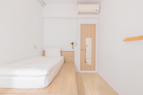 Postel nebo postele na pokoji v ubytování OwlStay Flip Flop Hostel - Garden
