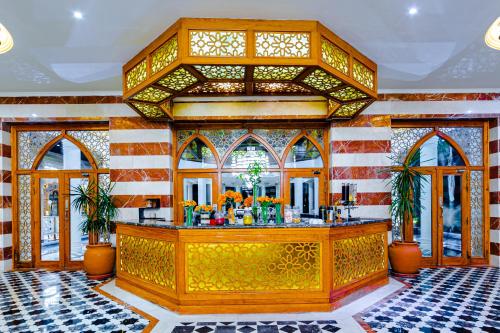 a lobby with a bar in a building at Grand Palace - Couples only 18 years plus in Hurghada