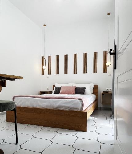 a bedroom with a bed and a piano at Anna's Apartment in Kato Daratso