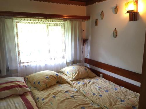 Postel nebo postele na pokoji v ubytování Domek letniskowy Siemiany