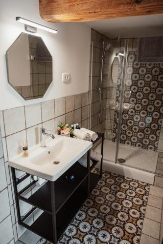 a bathroom with a sink and a shower at Kocbek since 1929 in Sveti Jurij ob Ščavnici