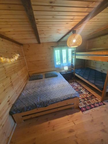 an overhead view of a bedroom in a log cabin at Almost Heaven - cabană cu vedere în Apuseni in Cîmpeni