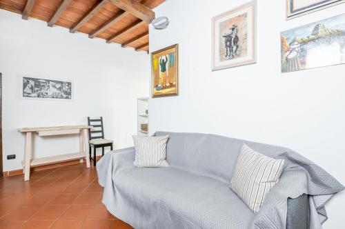 a living room with a couch and a table at Settignano Quiet Apartment with Private Parking in Settignano