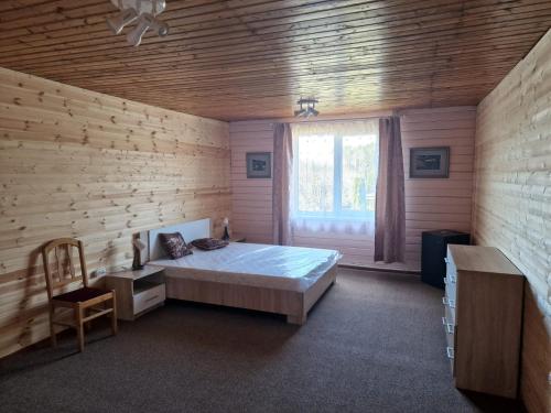 Postel nebo postele na pokoji v ubytování Ķīšupe 2