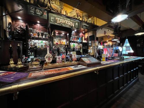 a bar with a lot of alcohol on the counter at Georgian House Hotel in Derby