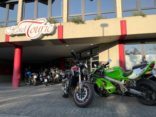 a group of motorcycles parked in front of a building at Hotel Touric in Korbach