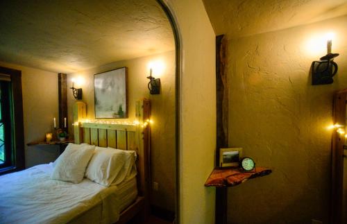a bedroom with a bed and lights on the wall at Vikings Villages Resort in Guilford