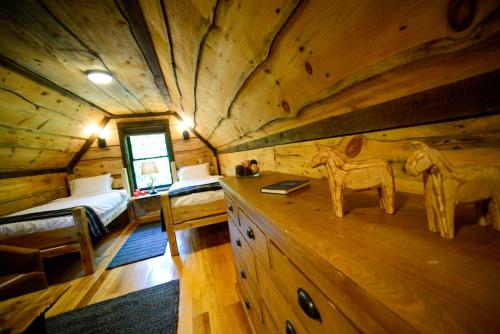 a log cabin with a bedroom and a bed in it at Vikings Villages Resort in Guilford