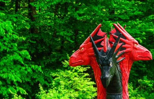 a red dragon statue in front of some trees at Vikings Villages Resort in Guilford