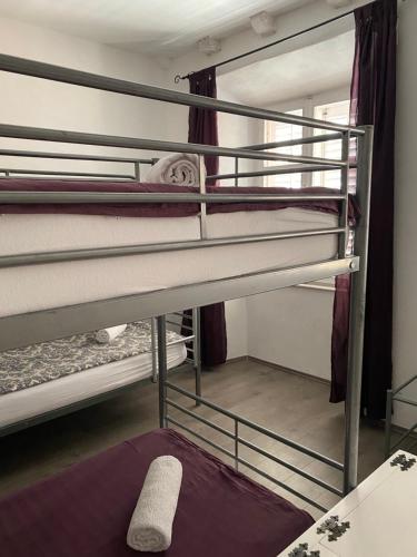 a room with two bunk beds in a room at Kingslanding Old Town Hostel in Dubrovnik