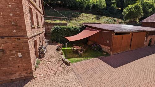 an overhead view of a building with a tent at Hof Helmenhube 2 in Gammelsbach
