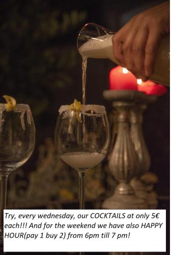 a person pouring wine into a wine glass at Wellness Villa Istriana in Umag