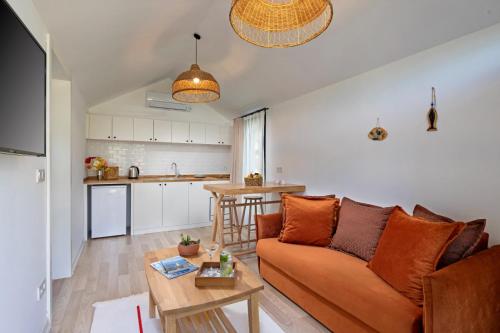 a living room with a couch and a table at Kairos Hotel in Kas