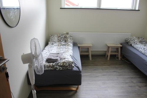 Una cama o camas en una habitación de Ljósavatn Guesthouse