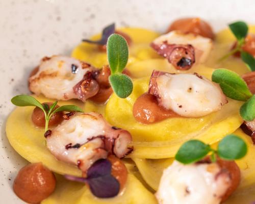 a plate of food with shrimp on top of pasta at Approdo Resort Thalasso Spa in Castellabate