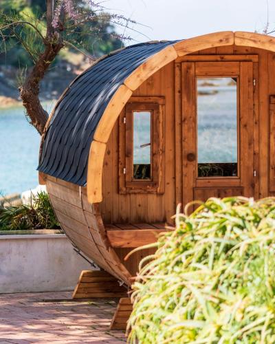 a wooden boat shaped house with a window at Approdo Resort Thalasso Spa in Castellabate