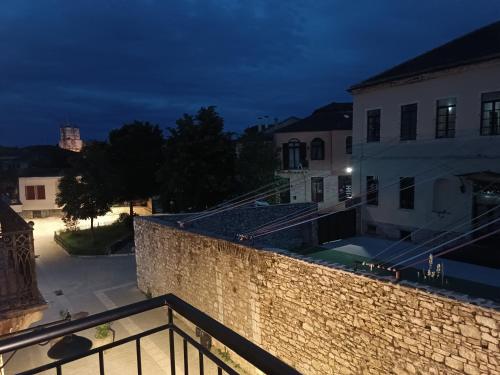 a view from the balcony of a building at night at Casa en el Lago -Luxury apartments in the historical center of Ioannina in Ioannina