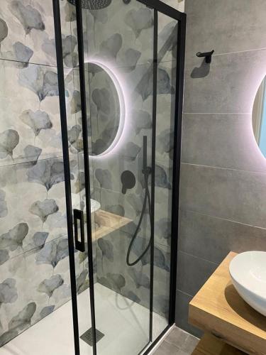a shower with a glass door in a bathroom at Acquamarina Casa Vacanze in Marina San Vito