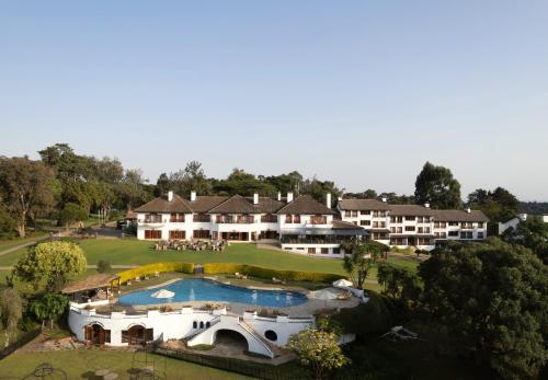 an aerial view of a resort with a swimming pool at Fairmont Mount Kenya Safari Club in Nanyuki
