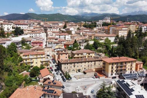 an aerial view of a city with buildings at Caldora Apartment in LʼAquila