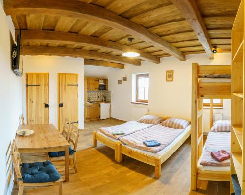 Postel nebo postele na pokoji v ubytování APARTMÁNY PAUSRAM