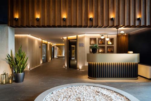 a lobby of a hotel with a reception desk at Kings' Valley Medical & Spa Hotel in Kazanlŭk