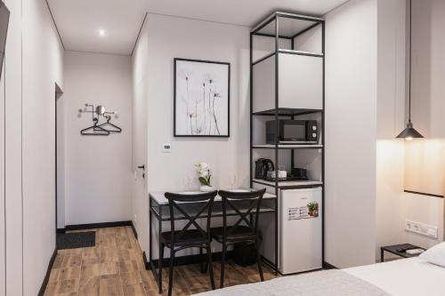Η κουζίνα ή μικρή κουζίνα στο Aura Home Dnipro